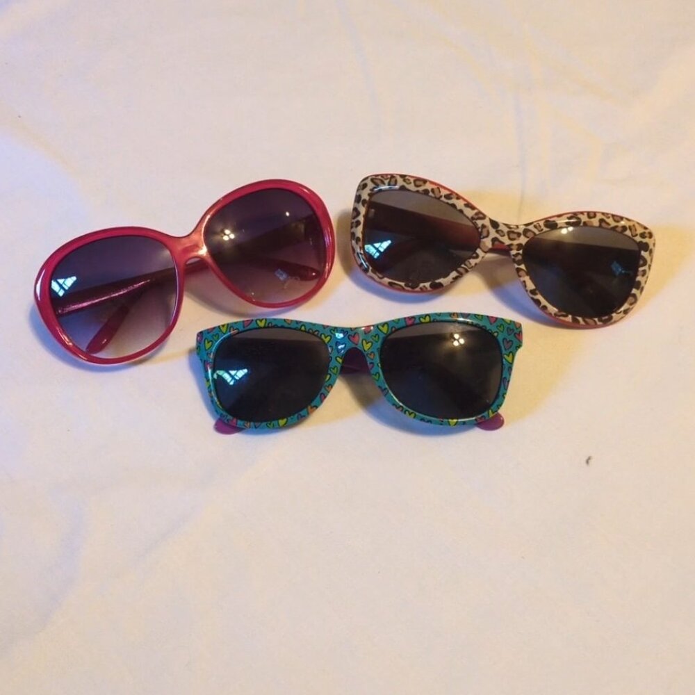 Three assorted colors kid and adult polarized sunglasses. 100% UV protection